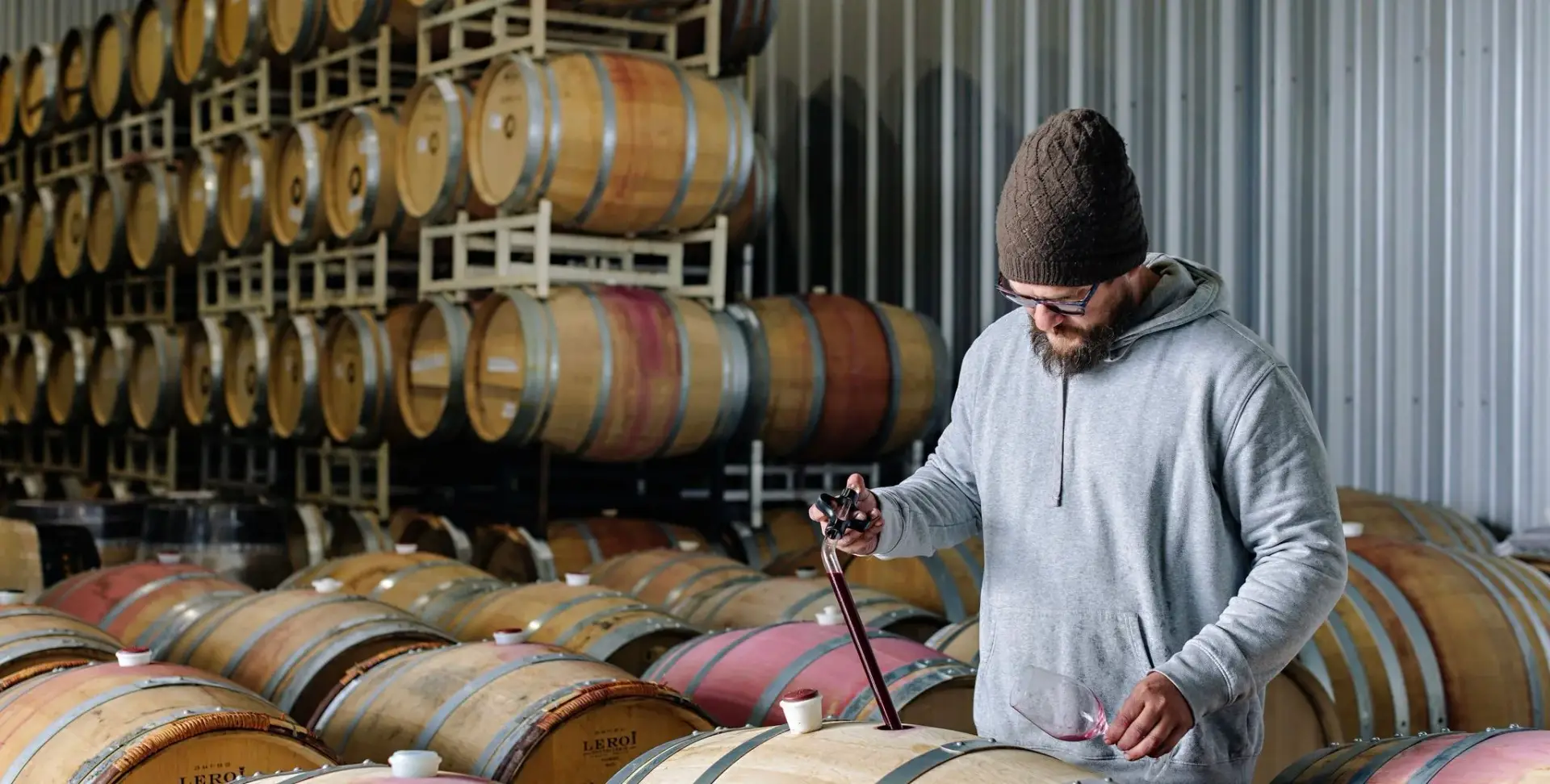  in the barrel room at  Three Sisters Winery  
